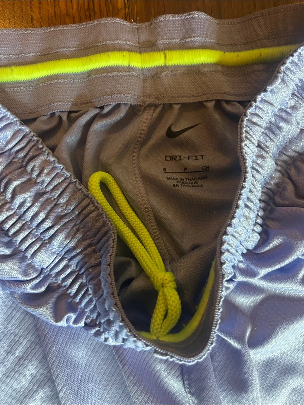 Nike Women’s Lavender Athletic Shorts with Neon Yellow Logo